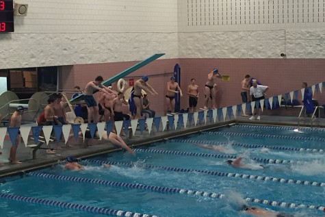 Sabre swimmers splash Warriors
