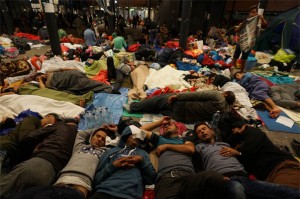 Syrian refugees resting in a Budapest railway station.