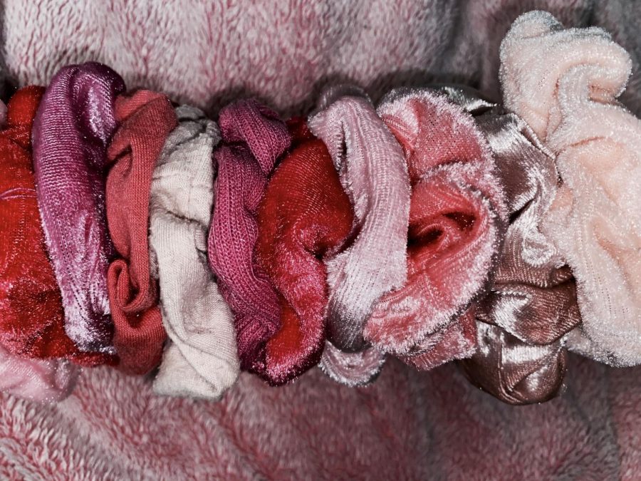 Pink is related to femininity, beauty, and softness. It is also the perfect color for a scrunchy.