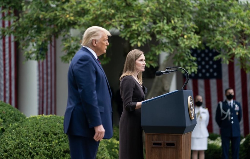 Donald Trump stands with his nominee for the supreme court; Amy Coney Barrett
