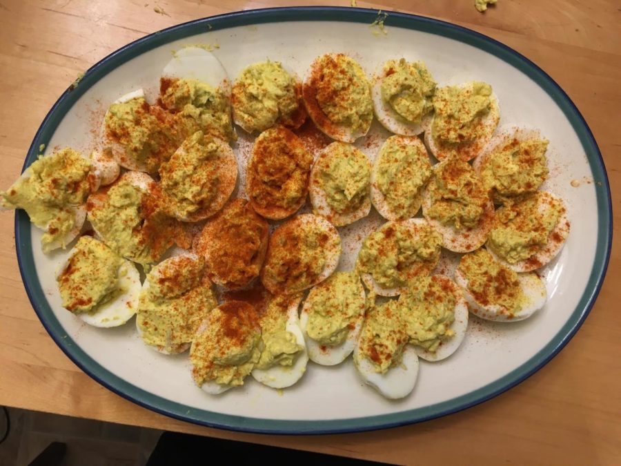The only step left is to sprinkle paprika over the deviled eggs.