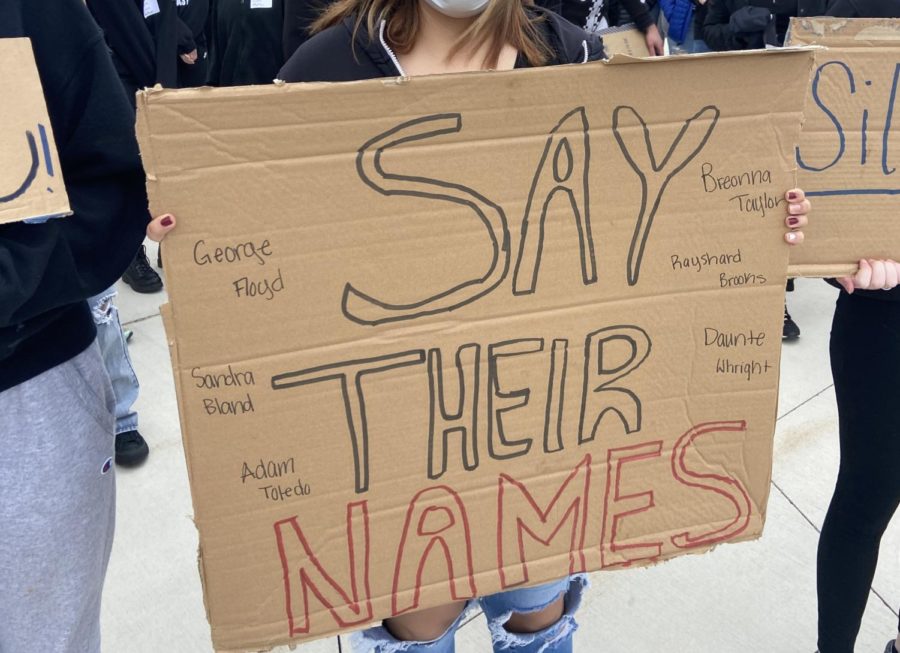 Sign student held at walk out.