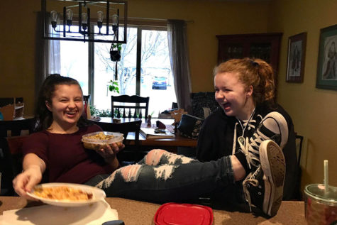 Sisters Olivia (Saretll senior) and Isabel Binsfeld (Sartell 7th grader) laughing at an inside joke.