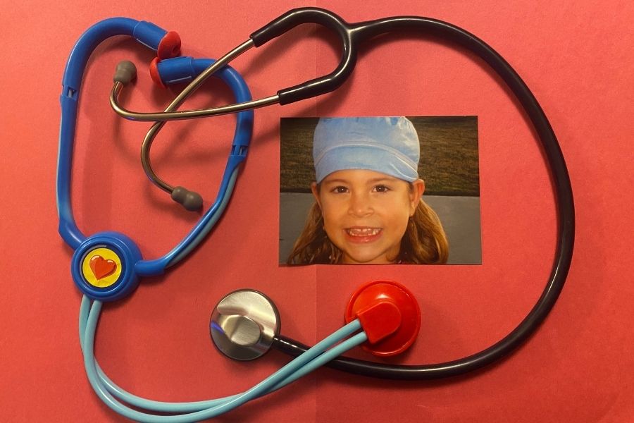 Two stethoscopes with a picture of Kelsi inside on halloween in 2010 dressed as a doctor.