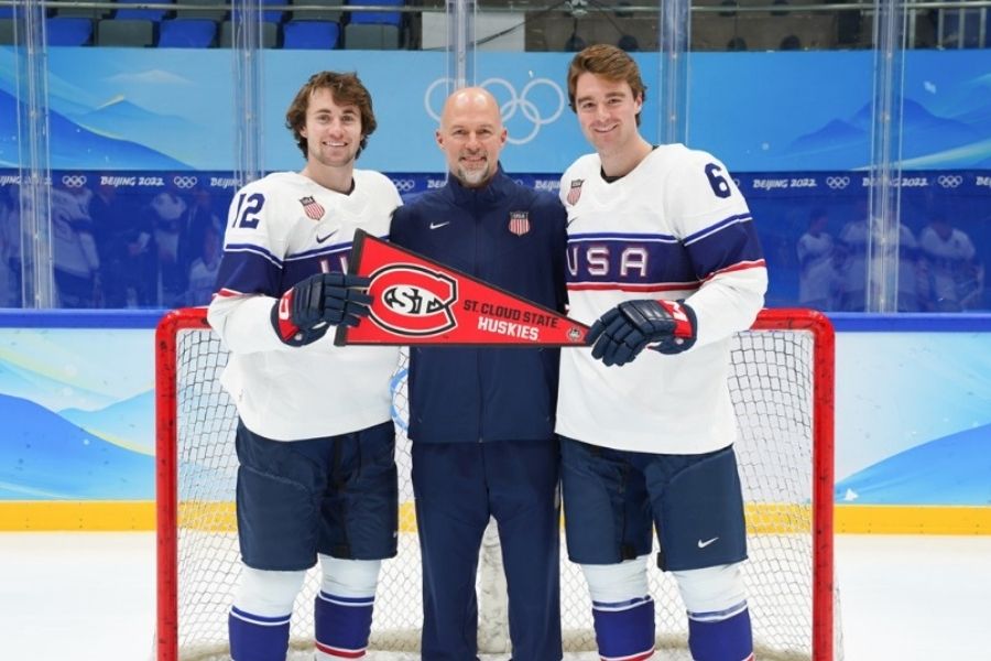 Nick Perbix and Sam Hentges with coach Brett Ladner in Beijing for the 2022 winter olympics. 