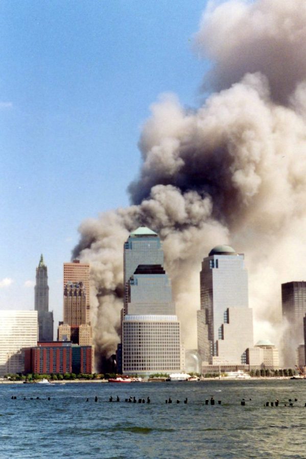 An attack on the world trade center from 2 hijacked planes in lower manhattan, NY. 