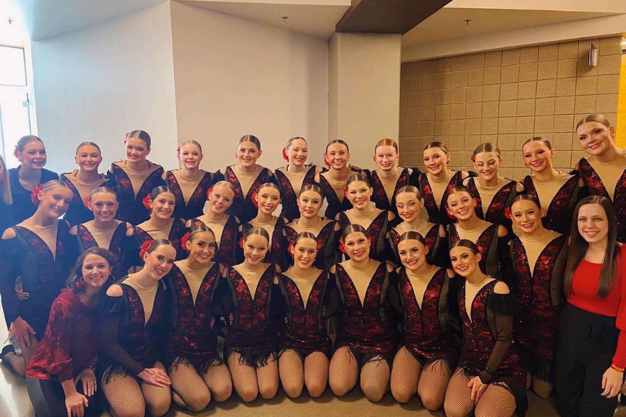 The+Sartell+dance+team+poses+before+they+go+on+the+floor+one+last+time+for+their+2022+season.