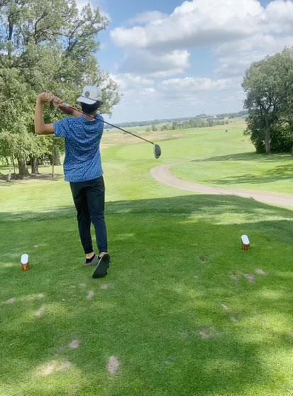 Bennett using his driver to land the ball on the fairway
