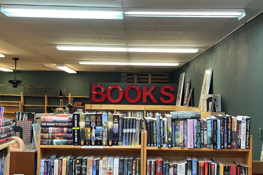 The sign hanging above the shelves at Books Revisited in St. Cloud.