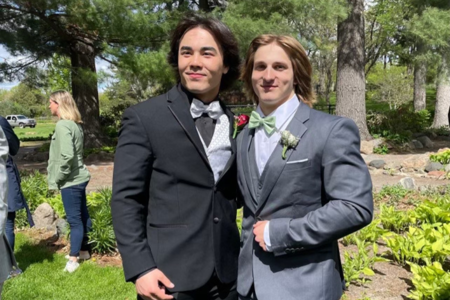 Donovan and AJ pose for pictures at their junior year prom. 