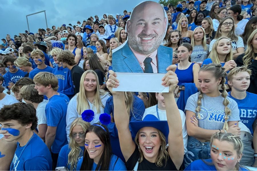 Ava Kampa and the whole school were getting pumped up before the hoco game with a cut out of Principal Kusler.