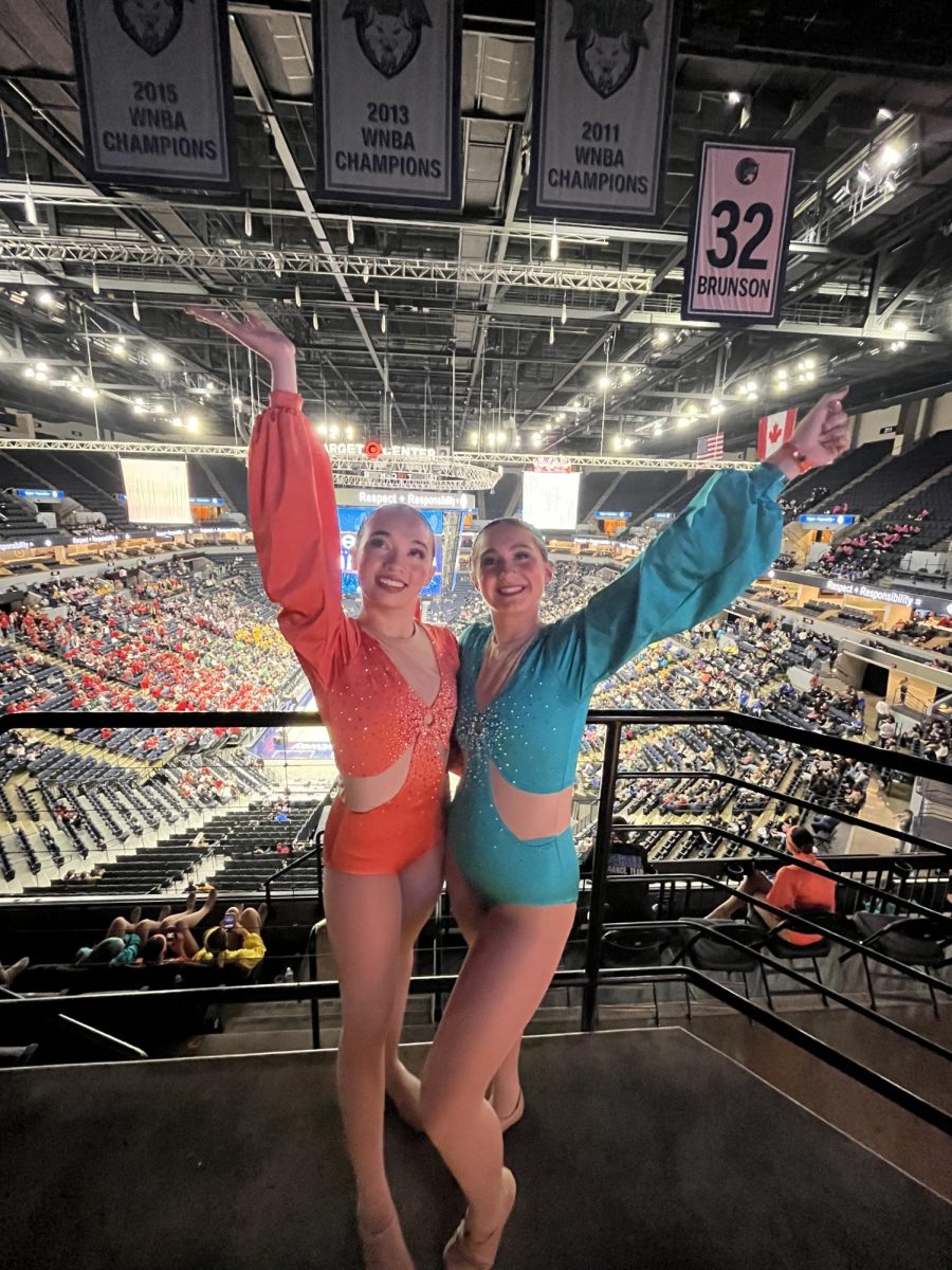Dance team Senior Kinzie Cusipag and Junior Lily Warnert pose for a picture at the Target Center at last years state. 