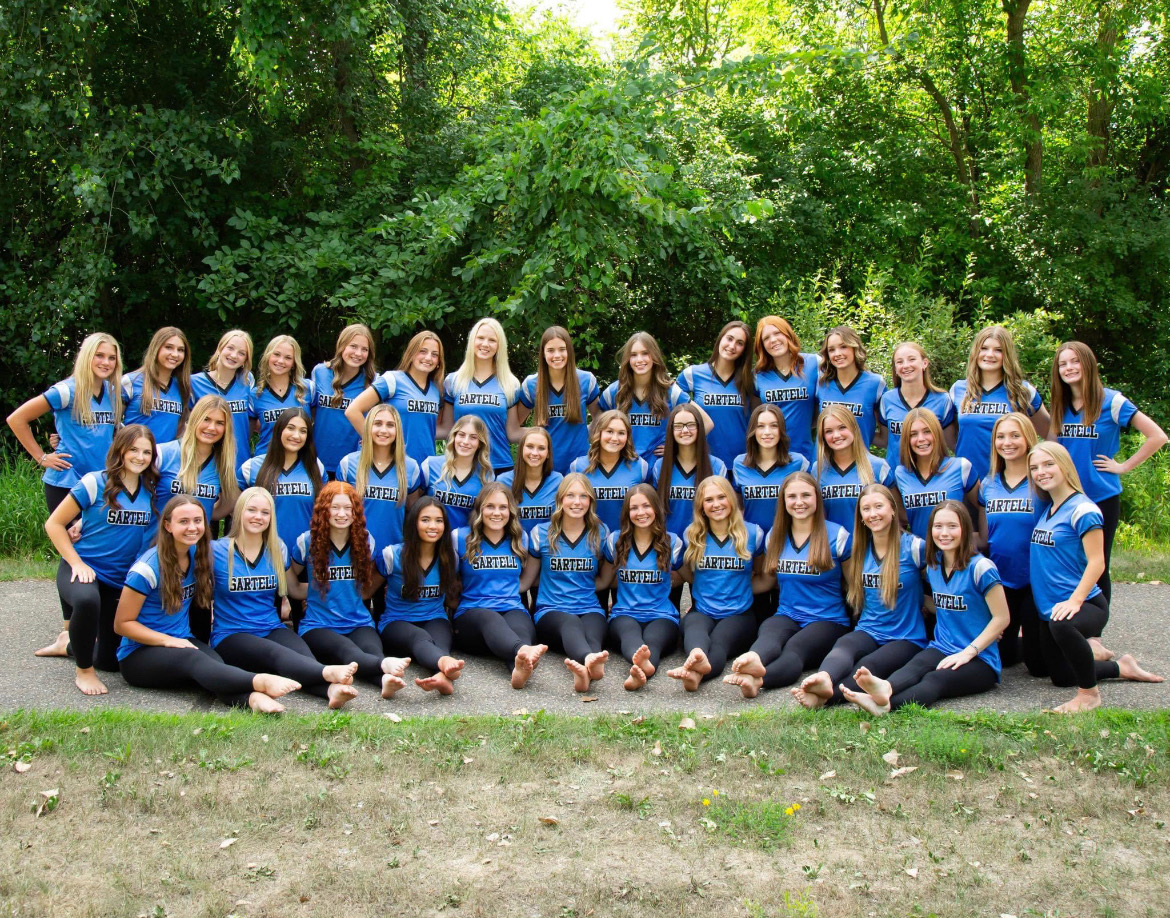 The Sartell Dance Team poses for their fall season pictures behind Sartell City Hall. 


