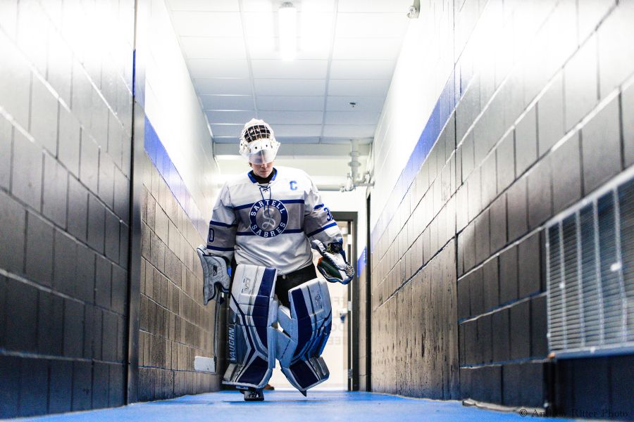 Senior goalie and team captain, Noah Hacker, walks out of the tunnel prior to the game vs. Alexandria (photo used with permission from Andrew Ritter).