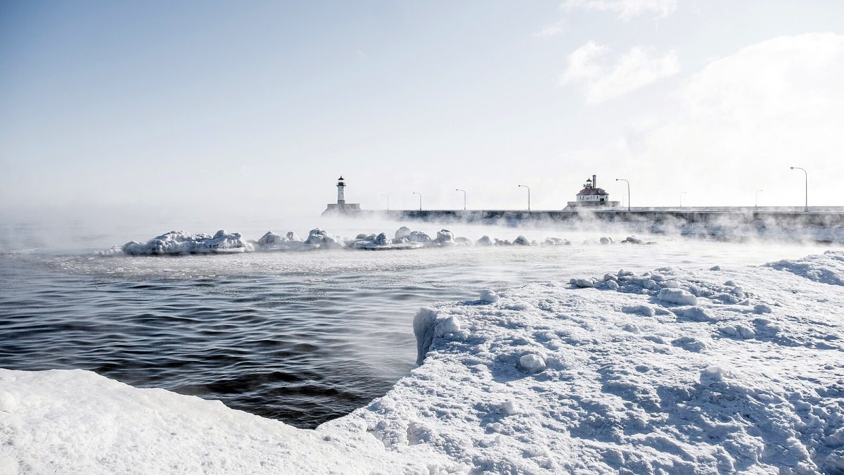 Duluths pristine shoreline enveloped in an icy mist from Lake Superior. Duluth North Pier Light by Sharon Mollerus is licensed under Attribution 2.0 Generic.

