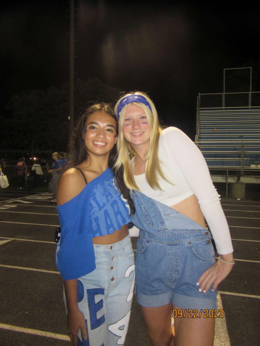 Sartell High School junior Sawyer Timmer, and senior Kinzie Cusipag pose for a photograph at Kinzies last homecoming game. 