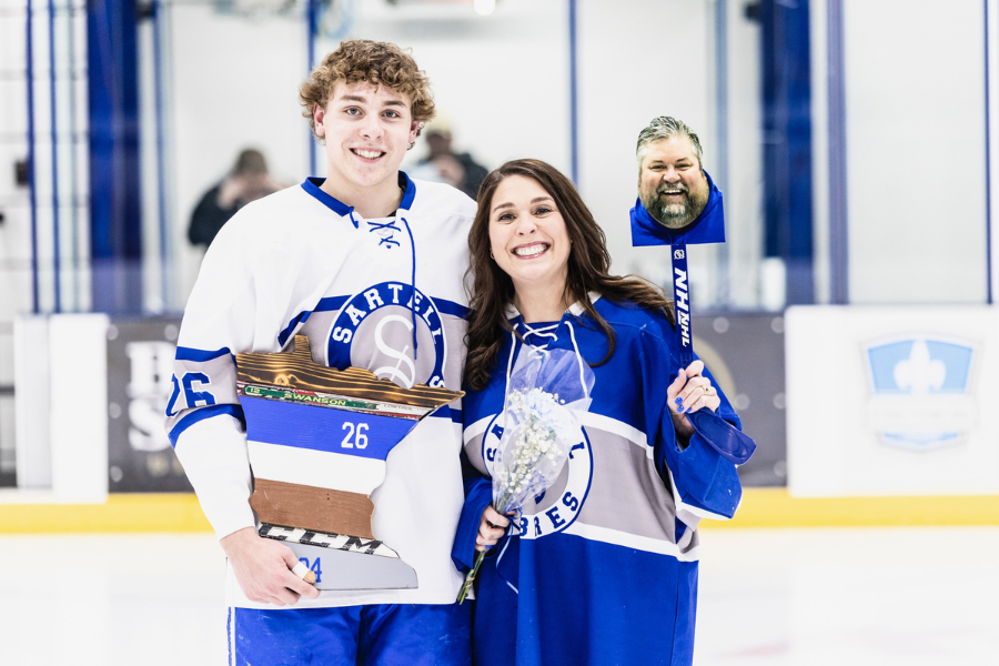 This image shows senior right-wing Zachary Swanson with his parents on senior night. (Photo used with permission from Andrew Ritter.)