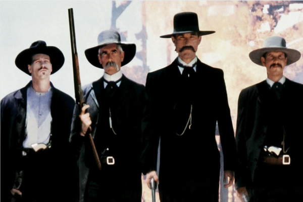 Val Kilmer, Sam Elliot, Kurt Russel, and Bill Paxton (Left to Right) in a scene in the 1993 film Tombstone. This photo by wikimedia is licensed under  Creative Commons Attribution.
