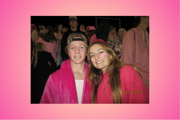 Amelia Larcom and Drew Bollinger rock all pink at their home football game. (Fair use photo from Amelia Larcom).