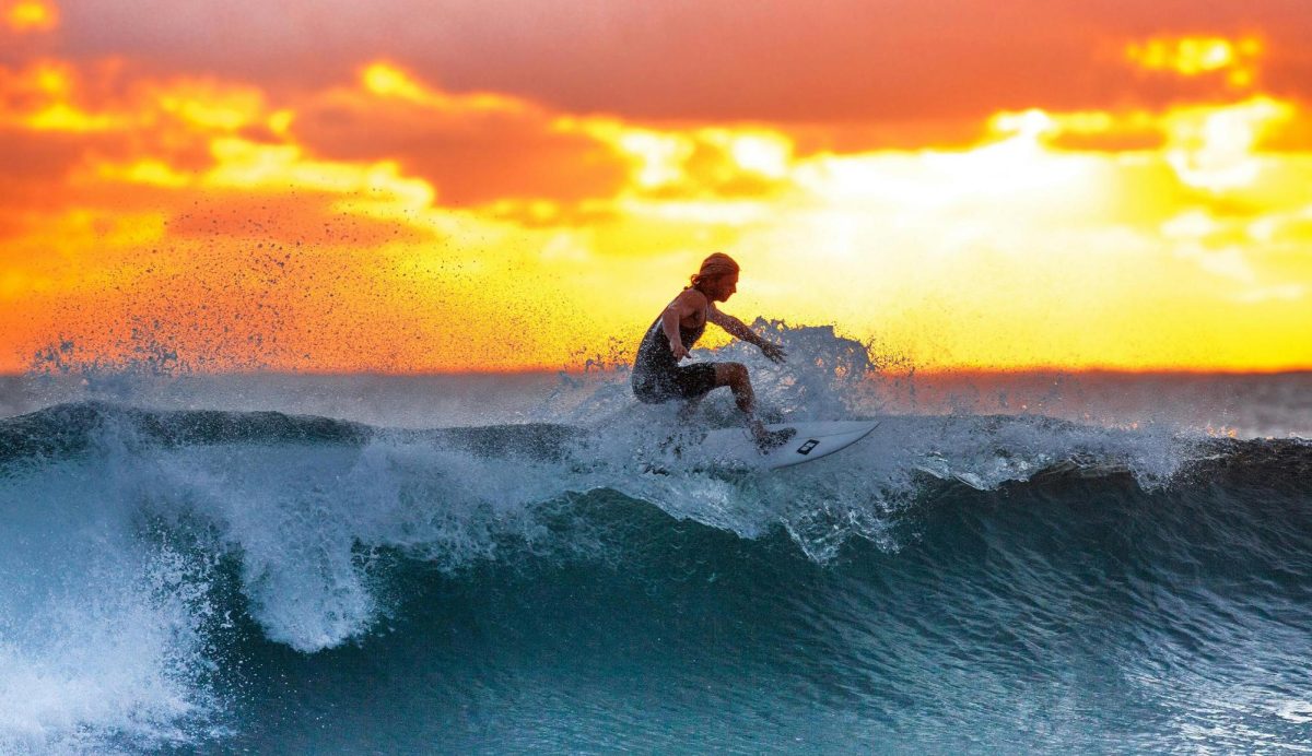 Surfing+is+an+amazing+hobby+if+you+live+close+to+the+ocean.+Sunset+surfer+by+Pixabay+is+licensed+under+CCO.
