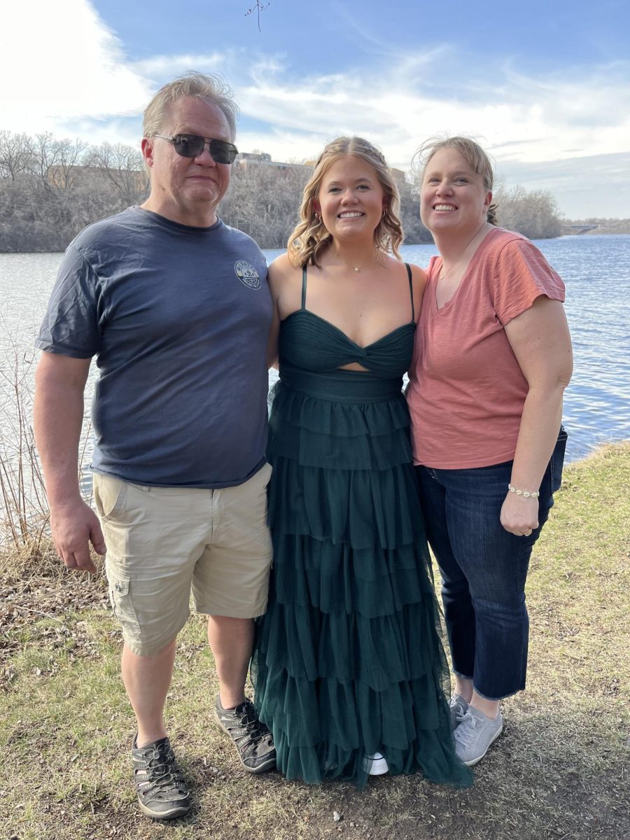 Erin, her mom, and her dad, taking gorgeous photos before prom.