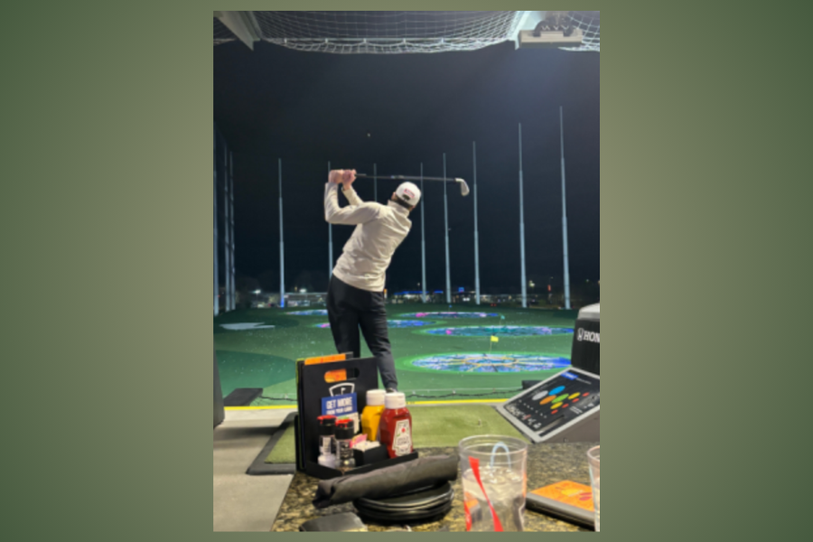 St. Cloud Tech Senior Caden Koehn hitting a ball with his seven iron.