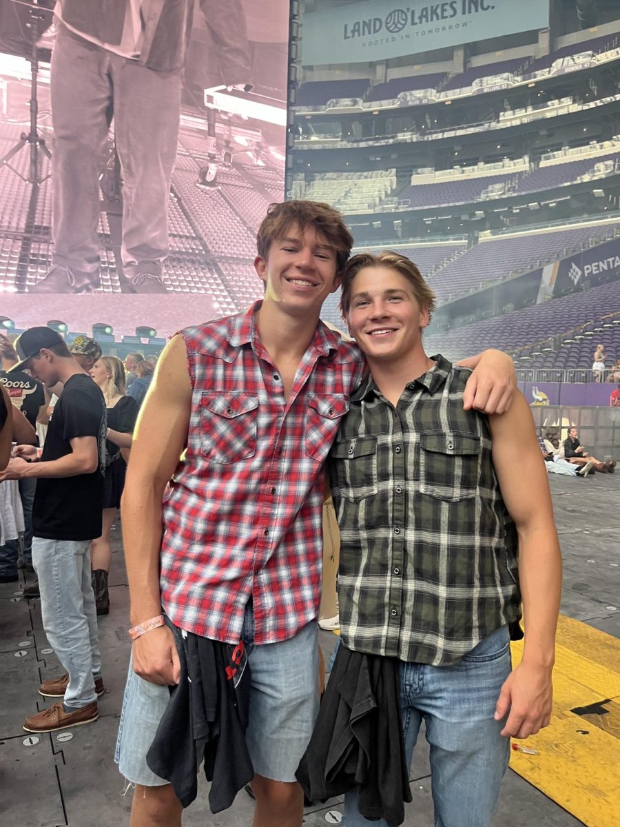 Connor with his friend and roommate attend a Zach Bryan concert.