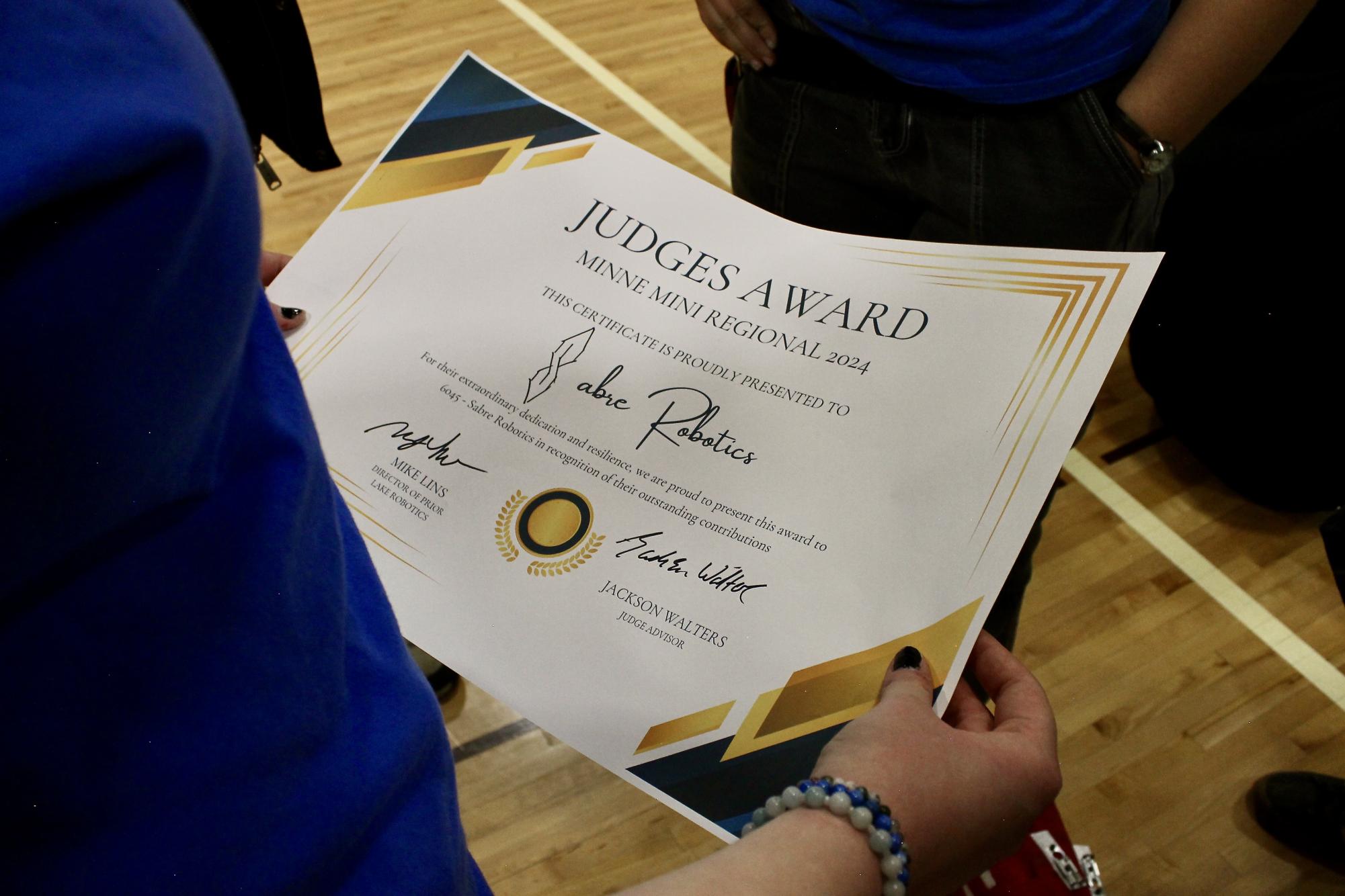 One of the hardest things the Robotics team has to do is win awards, luckily the team is very good at their job! (Photo used with permission from the 6045 Sabre Robotics Team)