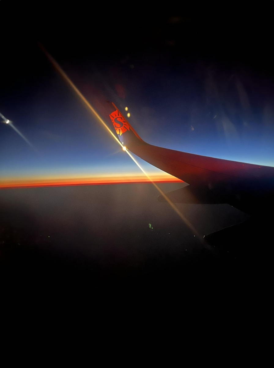 The sun rise on the plane while heading to Maleah's next vacation spot. (Photo used with permission by Maleah Forberg)