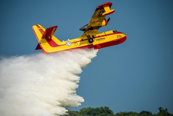 Authorities are doing everything they can to stop the Los Angeles fires. An Canadair CL-215 drops water by Preston Keres is licensed under CC0 1.0.