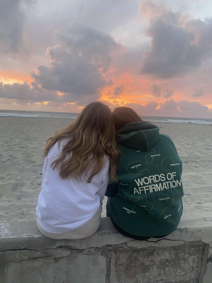 Sisters Addie and Stella Mortensen watch the beautiful sunset in San Diego together.