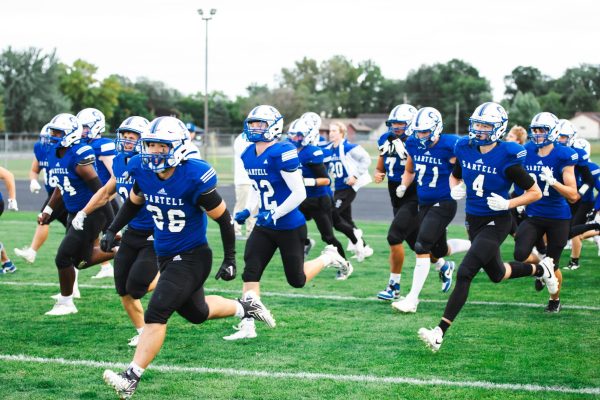 The Sabres run out onto the field for the pregame warm up. (Photo used with permission from Angie Heckman)