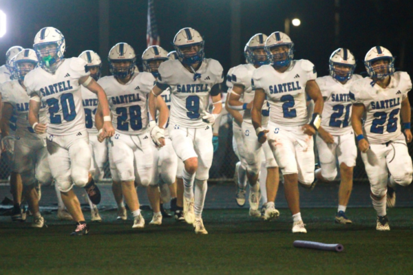The Sartell Sabres Football running back on the field after the halftime speech last Friday night.(Photo used with permission from Aaron Lang)