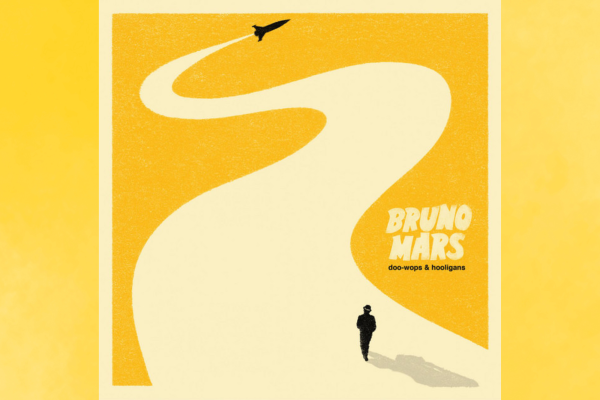 Bruno Mars is walking on a rocket ship's steam, forming a road. (Fair use photo from Spotify)