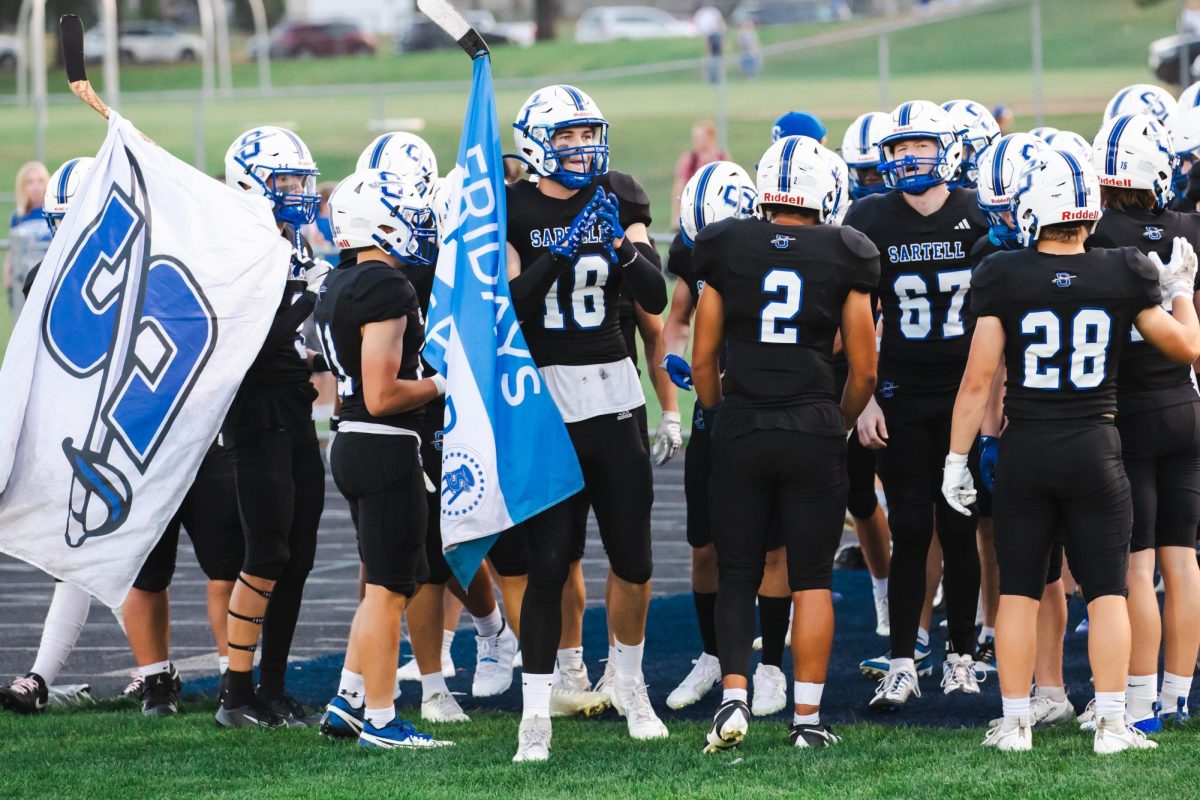 The Sartell Sabres waiting to run out pregame at the Homecoming game against the Sauk Rapids Rice Storm, Sabres won 21-7.(Photo used with permission from Angie Heckman)