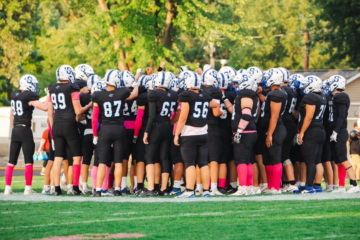 The Sartell Sabres football team gets together and is given a pregame speech before the big homecoming game.(Photo used with permission from Angie Heckman)