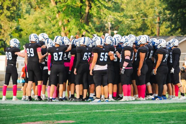 The Sartell Sabres football team gets together and is given a pregame speech before the big homecoming game.(Photo used with permission from Angie Heckman)