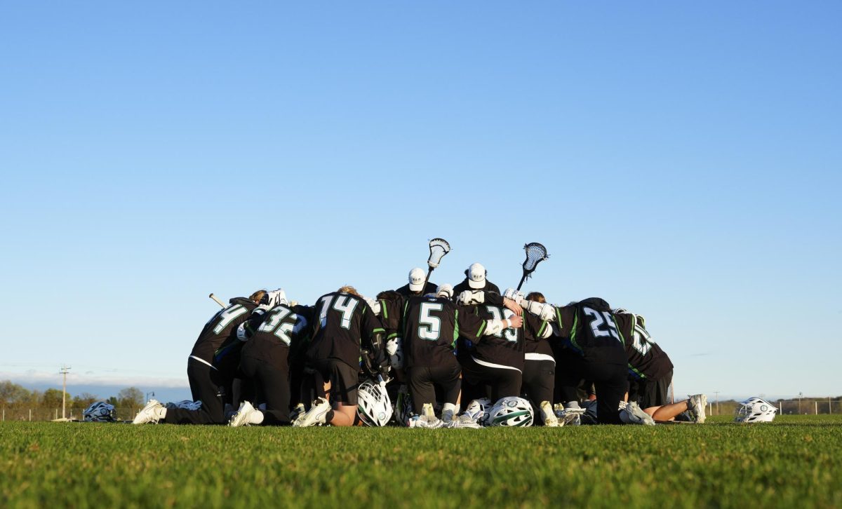 StormN Sabres lacrosse team praying after a win at home (Photo used with permission from Aaron Lang)