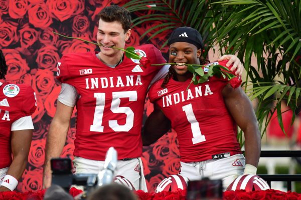 Jan 1, 2026; Pasadena, CA, USA; Indiana Hoosiers quarterback Fernando Mendoza (15) and running back Roman Hemby (1) celebrate after defeating the Alabama Crimson Tide in the 2026 Rose Bowl and quarterfinal game of the College Football Playoff at Rose Bowl Stadium. Mandatory Credit: Gary A. Vasquez-Imagn Images