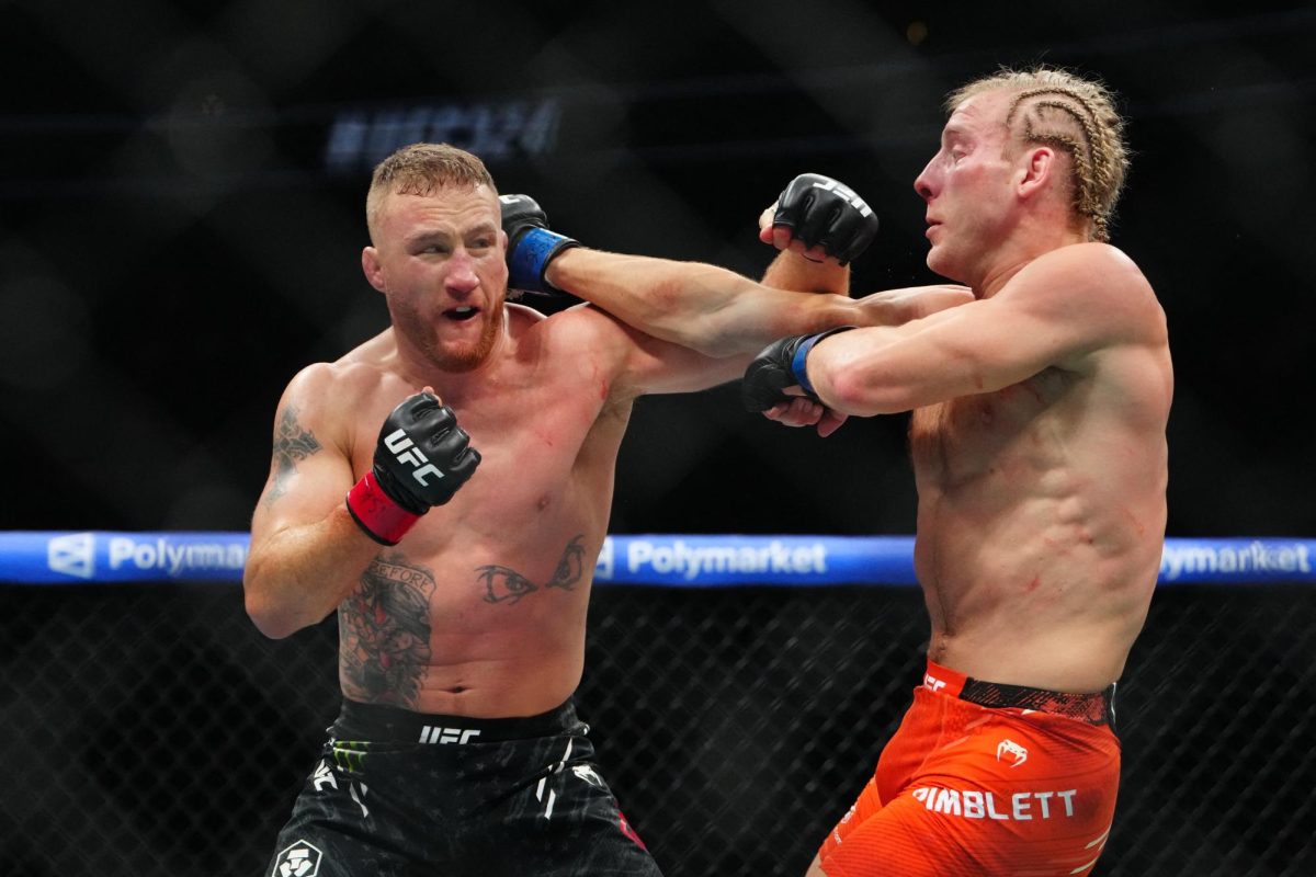 Jan 24, 2026; Las Vegas, Nevada, USA; Justin Gaethje (red gloves) fights Paddy Pimblett (blue gloves) during UFC 324 at T-Mobile Arena. Mandatory Credit: Stephen R. Sylvanie-Imagn Images