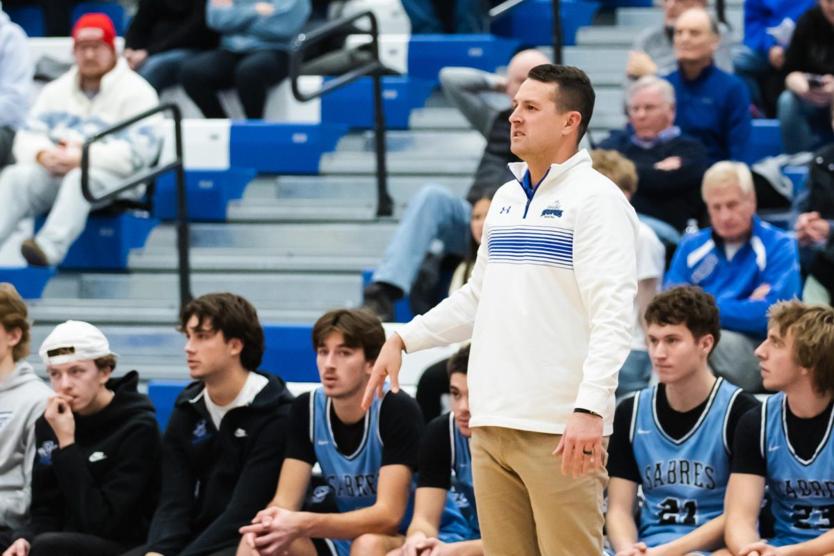 Coach Oistad analyzed the game as the Sabres played Apollo. (Photo used with permission from Angela Heckman)