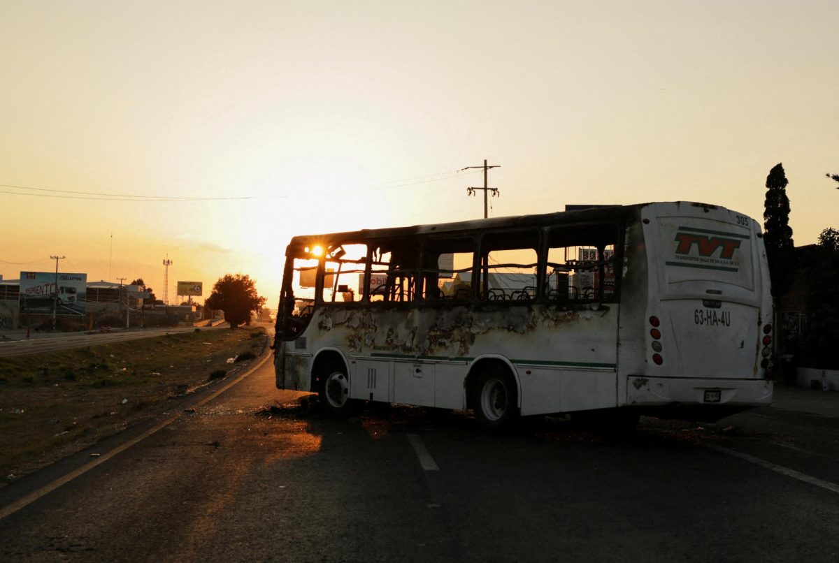 A burnt bus set up as a blockade by members of organized crime following a military operation in which Mexican officials said cartel boss Nemesio Oseguera, "El Mencho," was killed, at a tourist area, in Zapopan, Mexico, February 22, 2026. REUTERS/Gabriel Trujillo