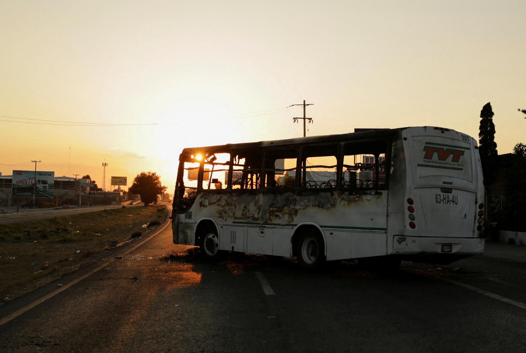 A burnt bus set up as a blockade by members of organized crime following a military operation in which Mexican officials said cartel boss Nemesio Oseguera, "El Mencho," was killed, at a tourist area, in Zapopan, Mexico, February 22, 2026. REUTERS/Gabriel Trujillo