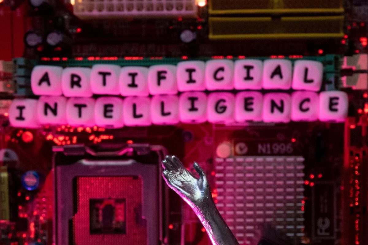 AI (Artificial Intelligence) letters and robot hand are placed on computer motherboard in this illustration taken, June 23, 2023. REUTERS/Dado Ruvic/Illustration