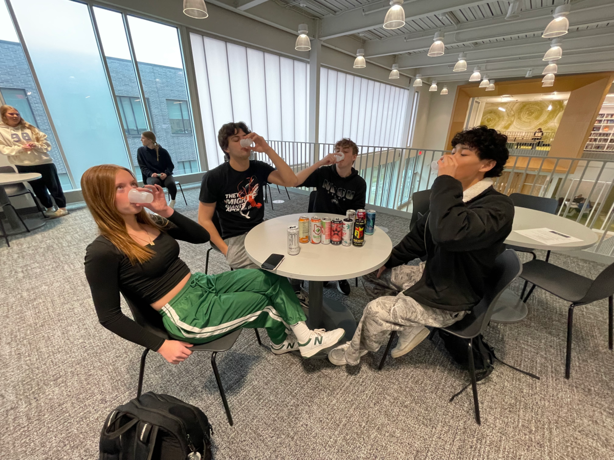 The squad collectively takes a sip of White Monster, a classic staple in energy drink discourse.